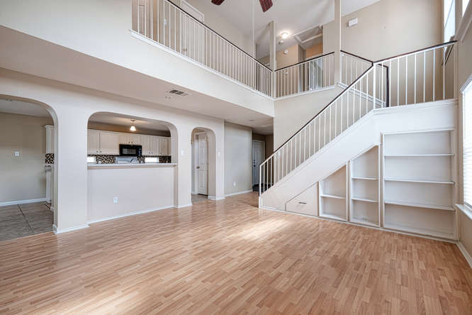 205 Polk Kyle, TX 78640 - Photo 4 of 22 Two-story living space featuring wood-finish flooring