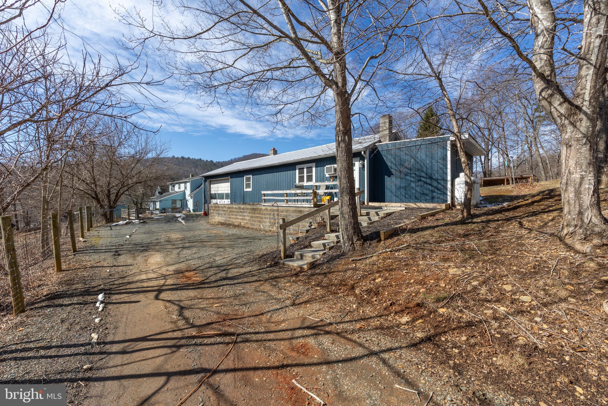 165 Brokenback Mountain Road Free Union, VA 22940 - Photo 16 of 55 a view of a house with backyard and trees