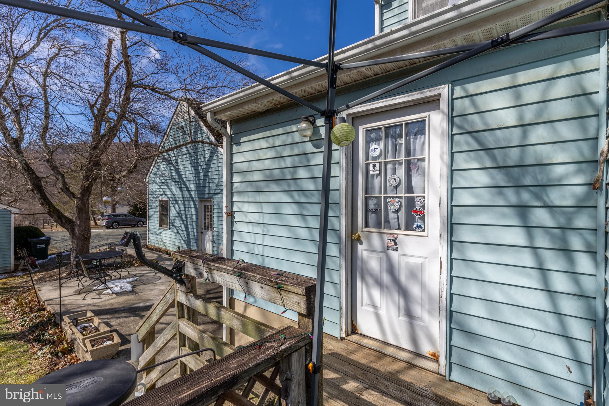 165 Brokenback Mountain Road Free Union, VA 22940 - Photo 26 of 55 a view of a porch with furniture and wooden floor