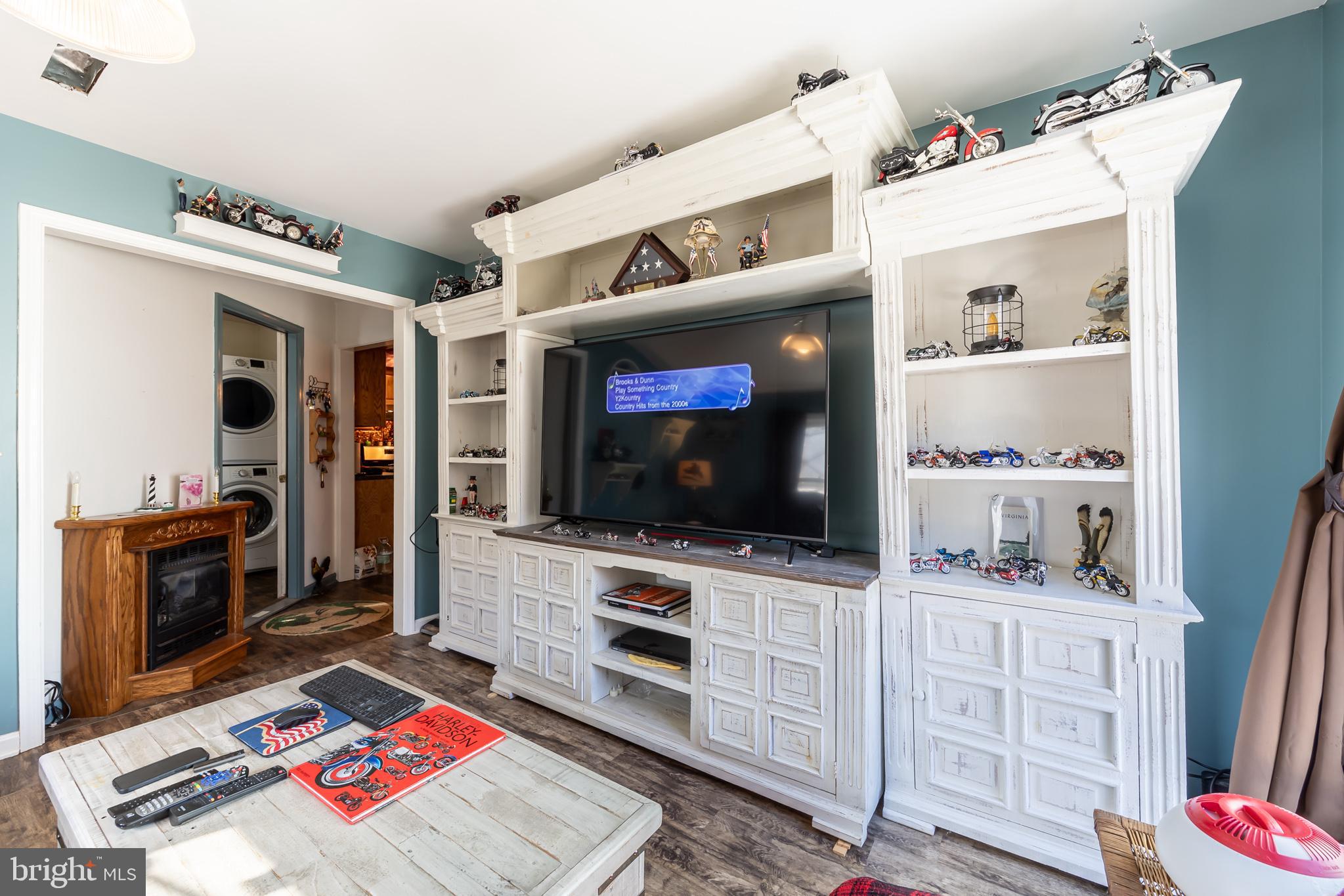 165 Brokenback Mountain Road Free Union, VA 22940 - Photo 33 of 55 a living room with furniture and a flat screen tv