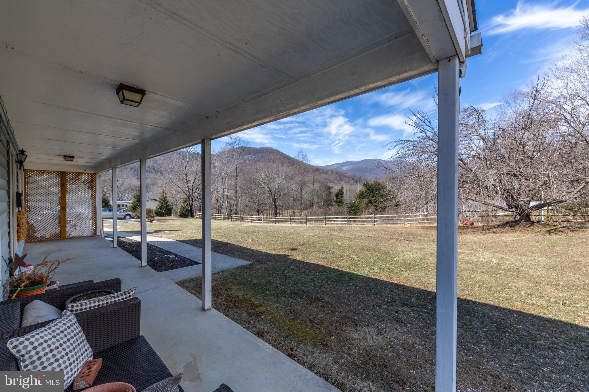165 Brokenback Mountain Road Free Union, VA 22940 - Photo 43 of 55 a view of a patio with a yard
