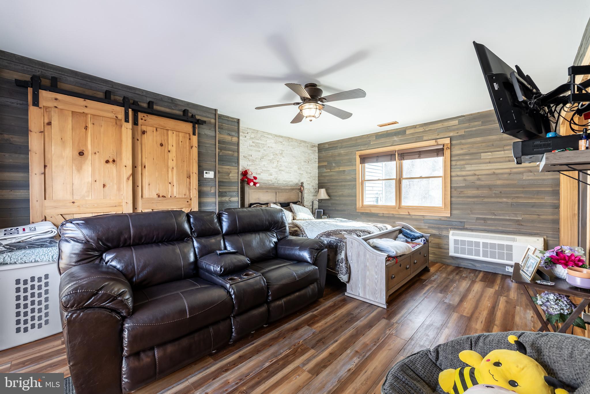 165 Brokenback Mountain Road Free Union, VA 22940 - Photo 51 of 55 a living room with furniture fireplace and a window