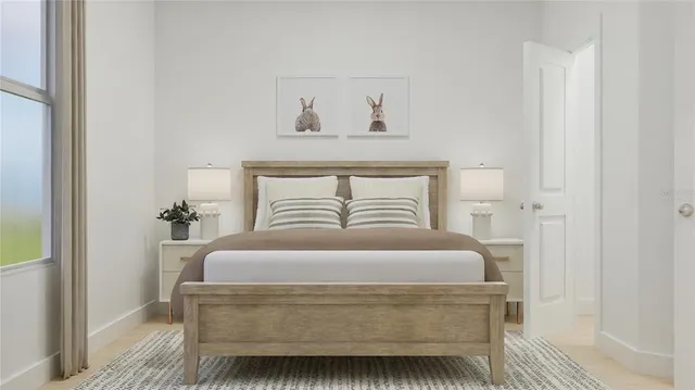 a bedroom with a bed and lamps