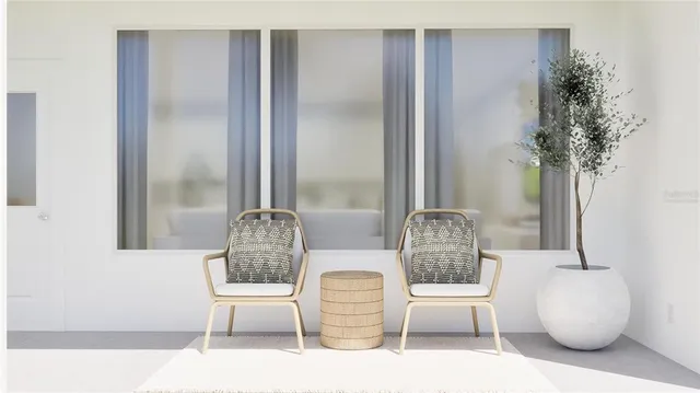 a view of a patio with a table and chairs