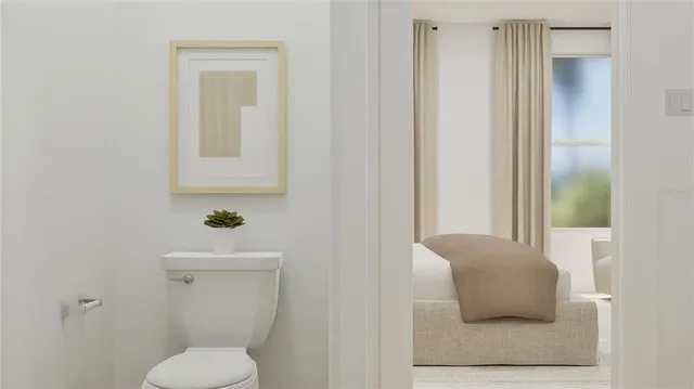 a bedroom with a bed and a night stand