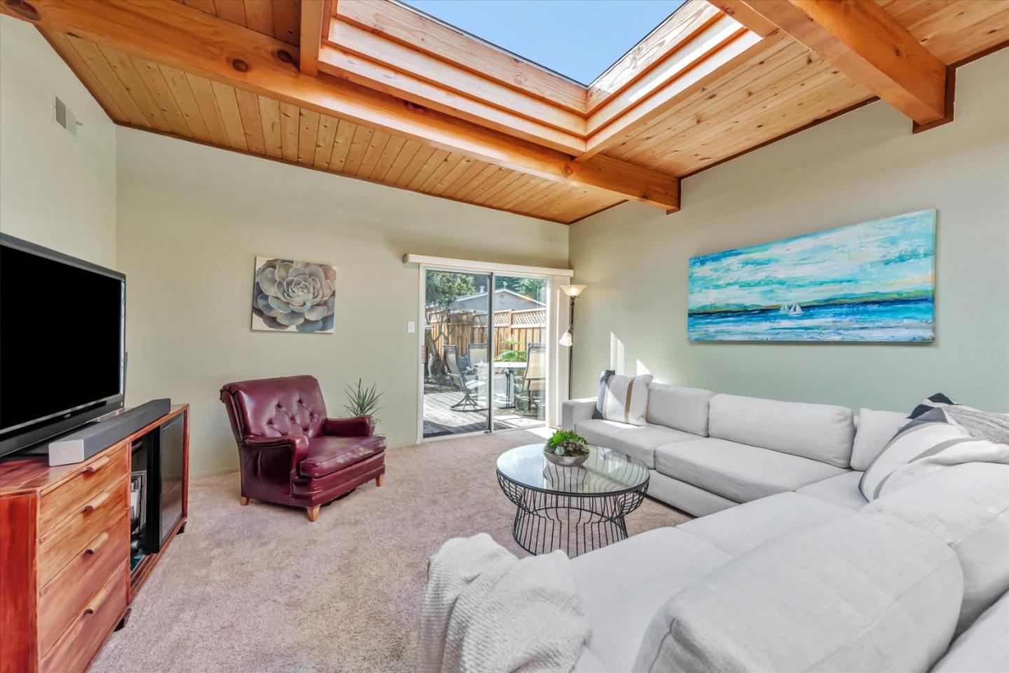 316 Greenway Drive Pacifica, CA 94044 - Photo 19 of 43 a living room with furniture and a flat screen tv
