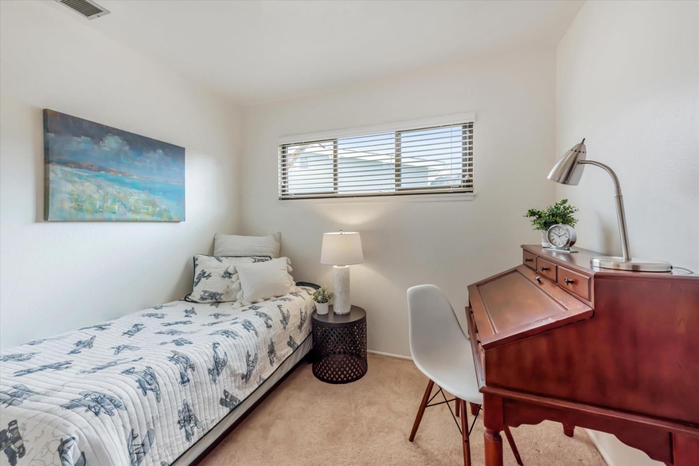 316 Greenway Drive Pacifica, CA 94044 - Photo 23 of 43 a bedroom with bed and a table