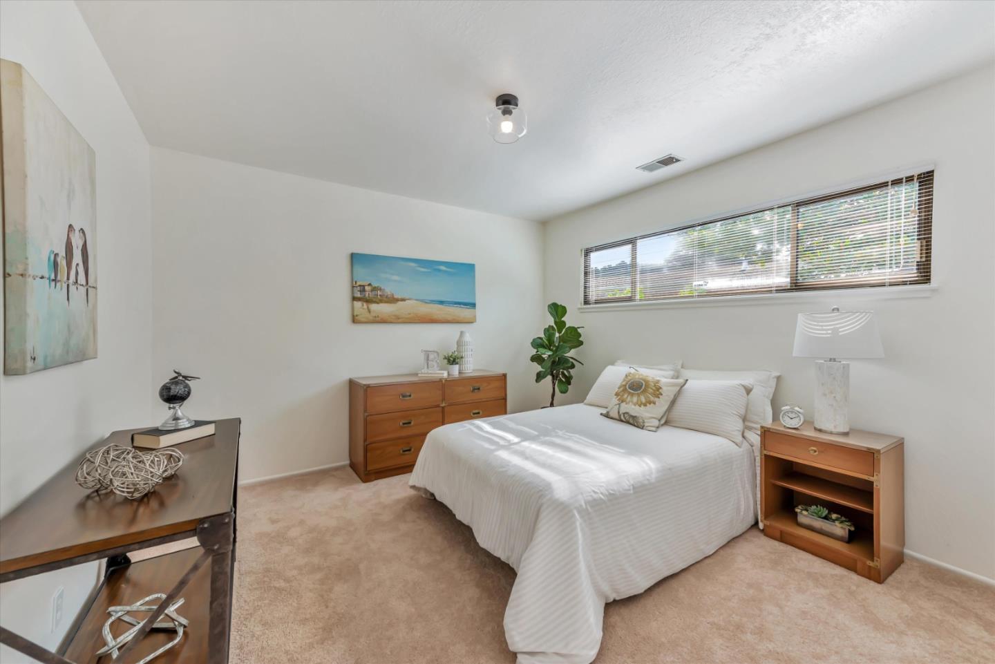 316 Greenway Drive Pacifica, CA 94044 - Photo 24 of 43 a bedroom with a bed and a table in it
