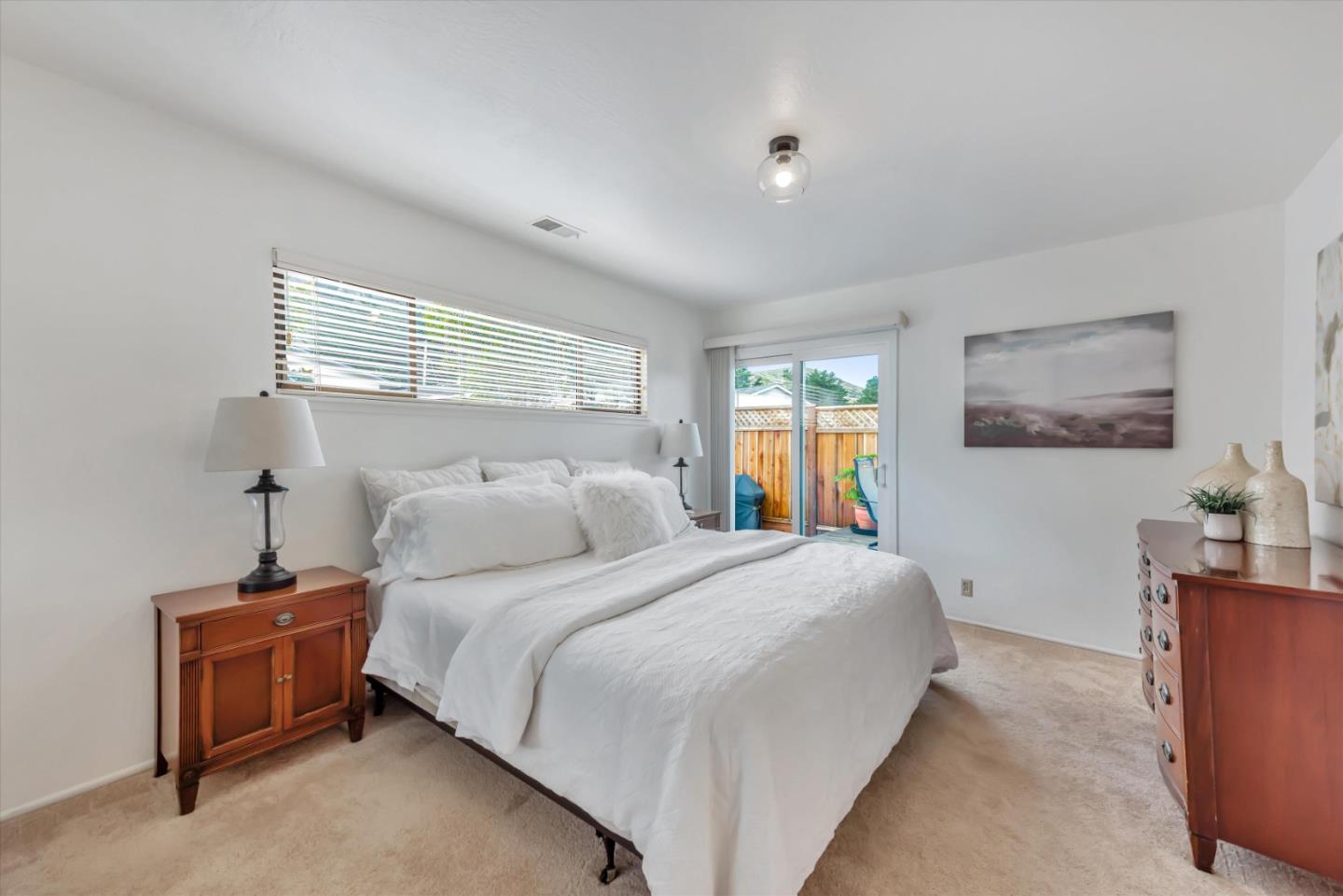 316 Greenway Drive Pacifica, CA 94044 - Photo 27 of 43 a bedroom with a bed and a couch