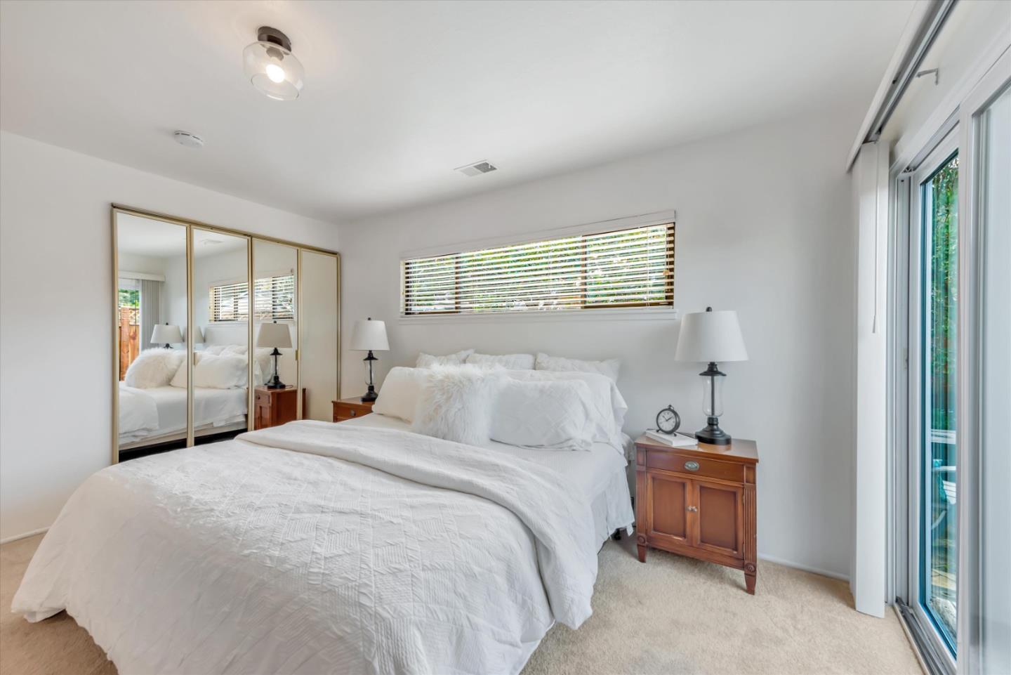 316 Greenway Drive Pacifica, CA 94044 - Photo 29 of 43 a bedroom with a bed and a window