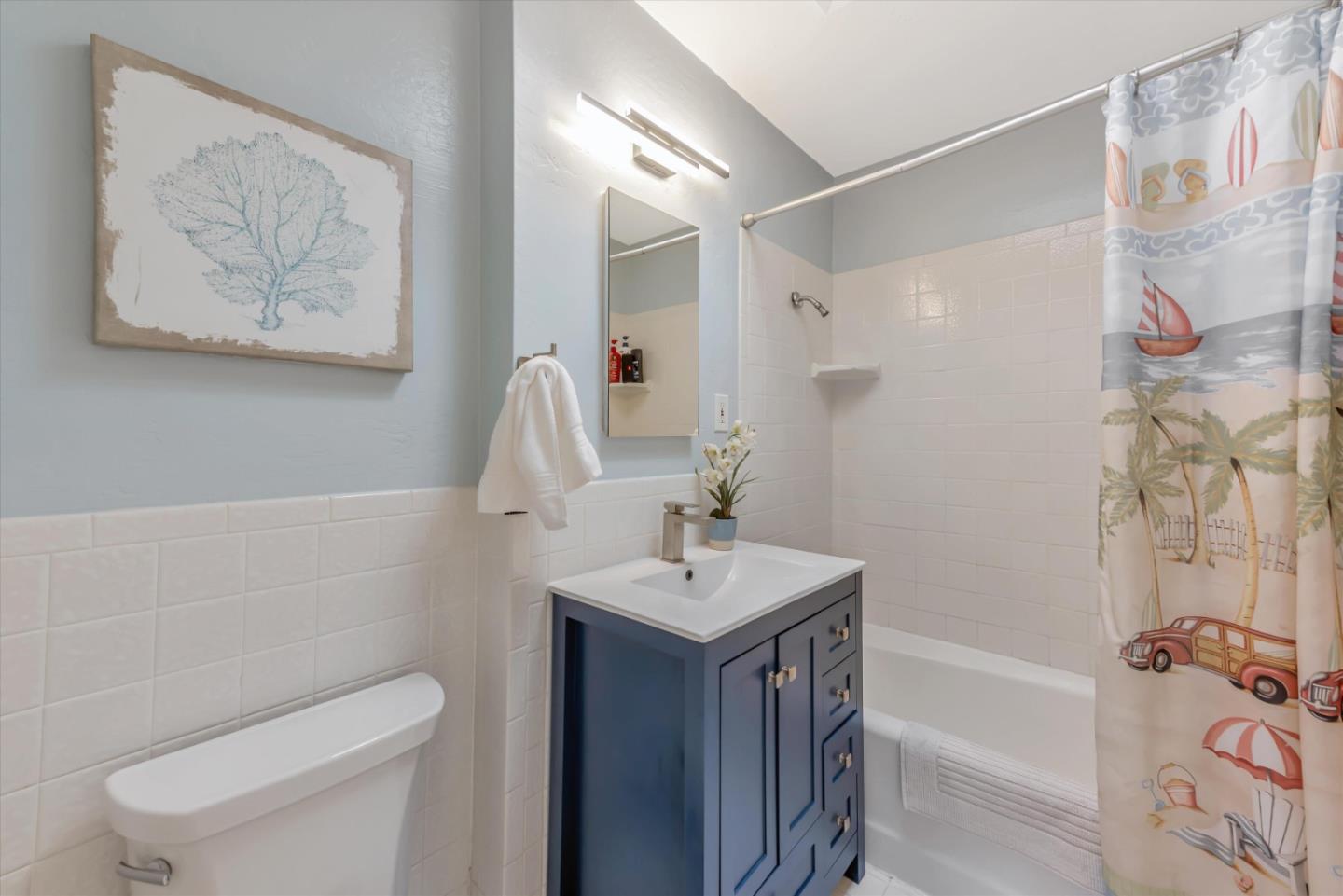 316 Greenway Drive Pacifica, CA 94044 - Photo 31 of 43 a bathroom with a sink a toilet and shower