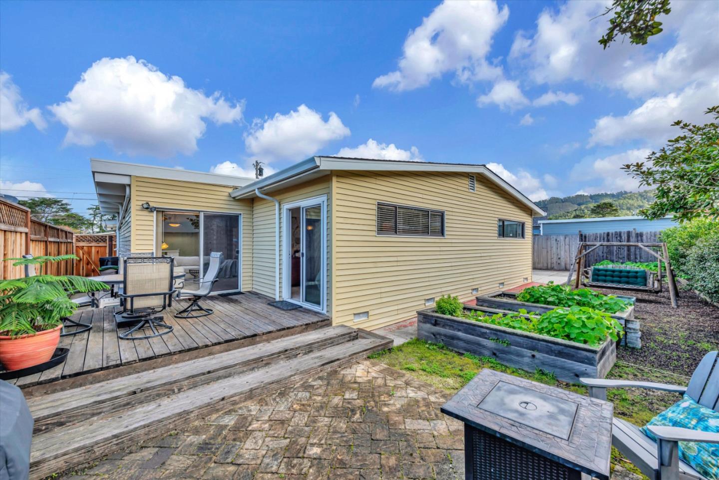 316 Greenway Drive Pacifica, CA 94044 - Photo 33 of 43 a view of a backyard with sitting area and furniture