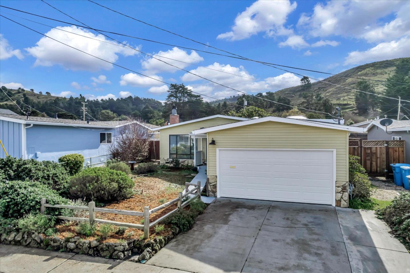 316 Greenway Drive Pacifica, CA 94044 - Photo 37 of 43 a view of a patio with table and chairs under an umbrella