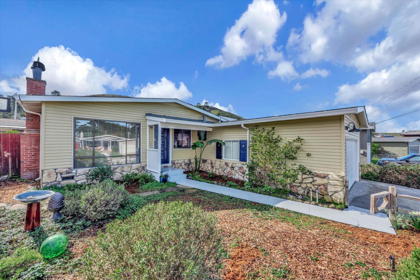316 Greenway Drive Pacifica, CA 94044 - Photo 5 of 43 a front view of a house with garden