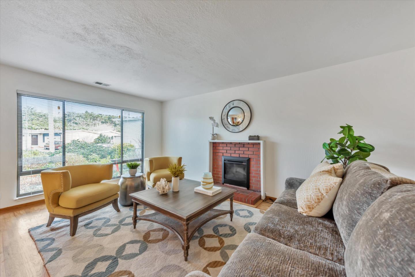 316 Greenway Drive Pacifica, CA 94044 - Photo 6 of 43 a living room with furniture and a fireplace