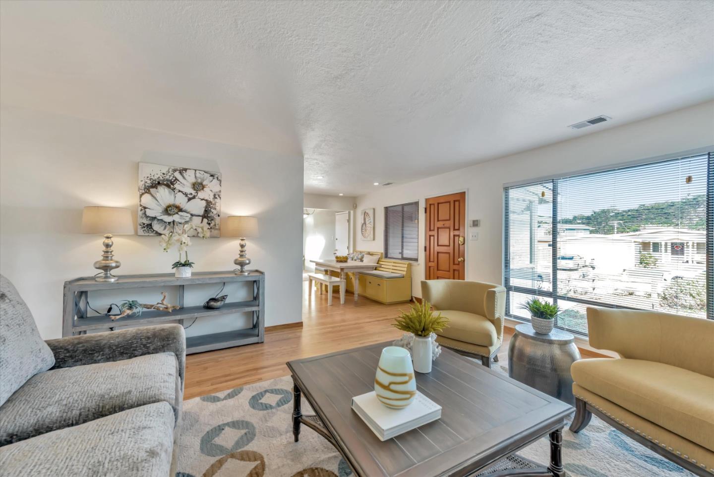 316 Greenway Drive Pacifica, CA 94044 - Photo 8 of 43 a living room with furniture a rug and a large window
