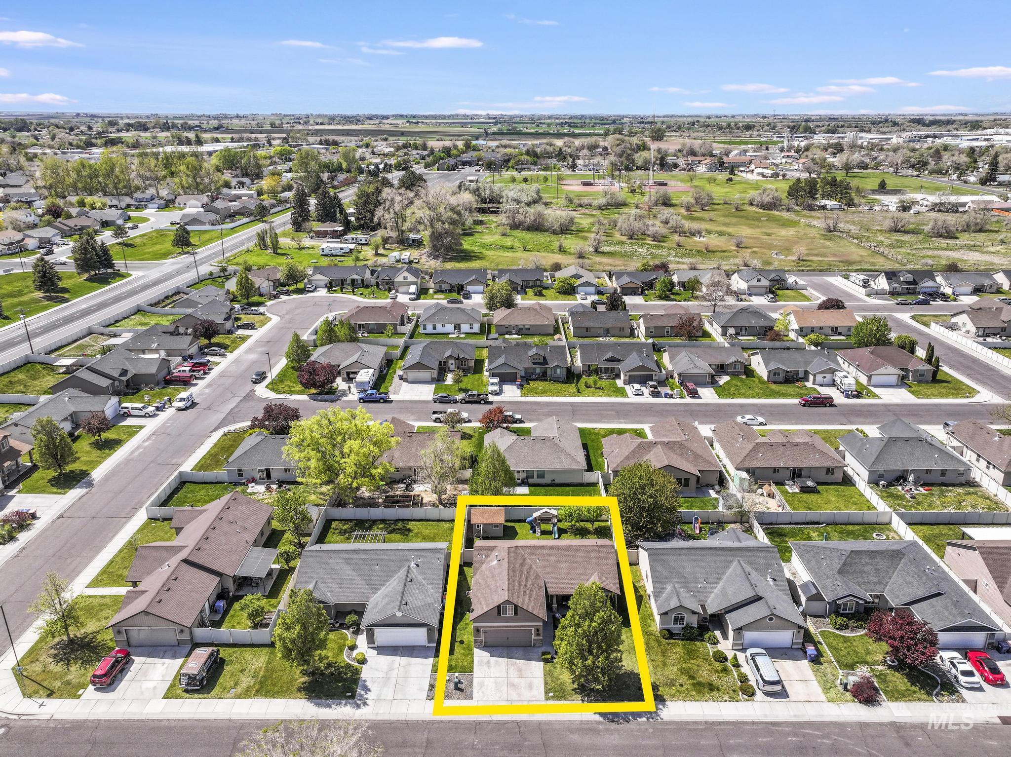 446 Noble Street Twin Falls, ID 83301 - Photo 40 of 42 Aerial view of a residential neighborhood with single-story homes, paved streets, and green landscaping