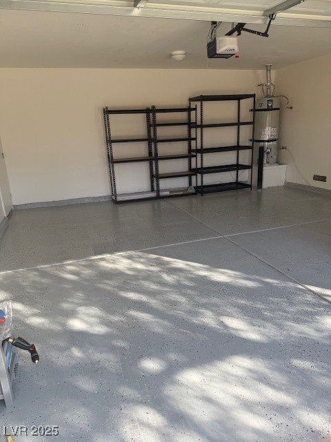 5474 Jacobs Field Street Las Vegas, NV 89148 - Photo 13 of 13 Garage featuring water heater and a garage door opener