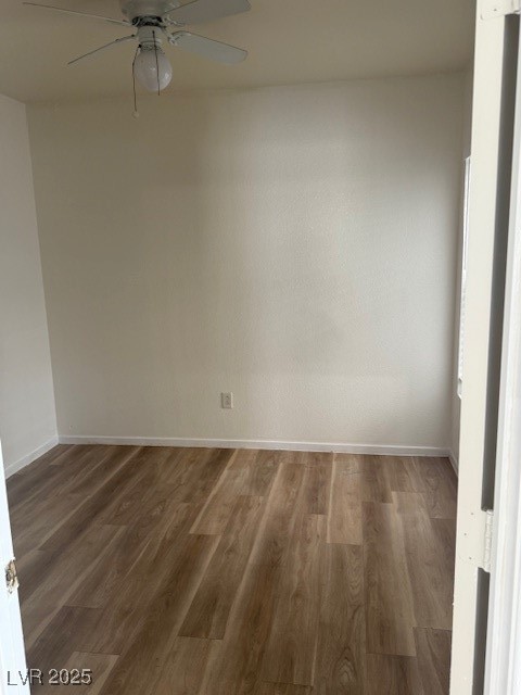 5474 Jacobs Field Street Las Vegas, NV 89148 - Photo 3 of 13 Spare room featuring wood finished floors and a ceiling fan