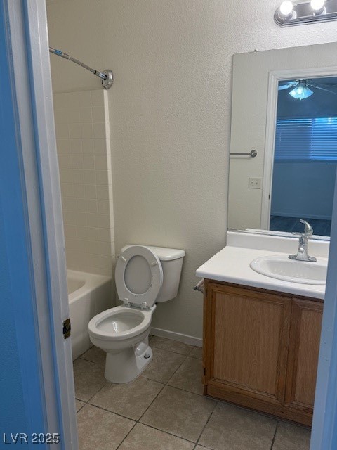 5474 Jacobs Field Street Las Vegas, NV 89148 - Photo 7 of 13 Master Bathroom with vanity, light tile patterned floors, a textured wall, and shower / bath combination