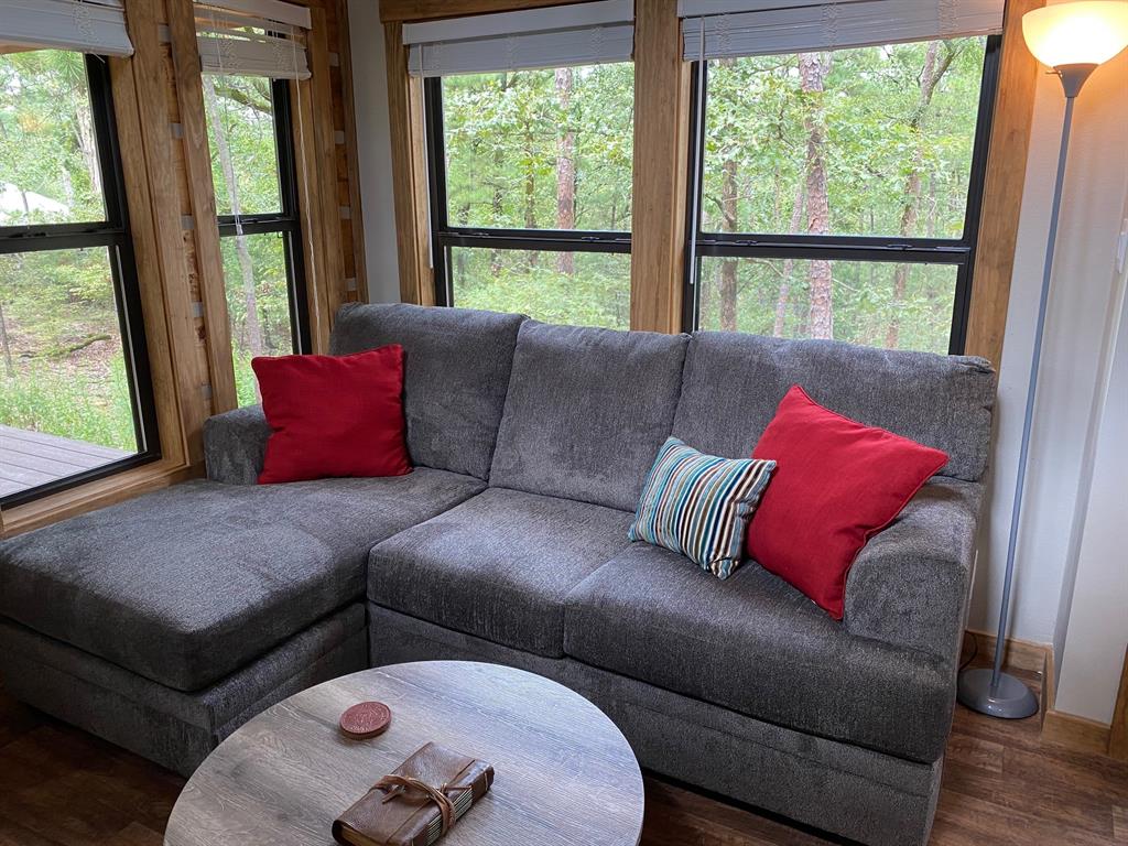 396 Choate Road Broken Bow, OK 74728 - Photo 6 of 19 a living room with furniture and a large window