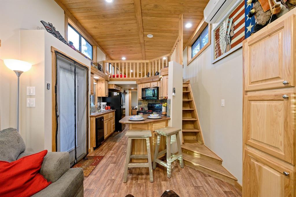 396 Choate Road Broken Bow, OK 74728 - Photo 7 of 19 a dining room with wooden floor and furniture