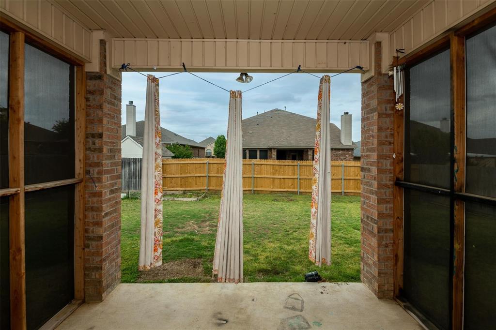7607 Yearling Way Arlington, TX 76002 - Photo 22 of 25 a backyard of a house with seating space