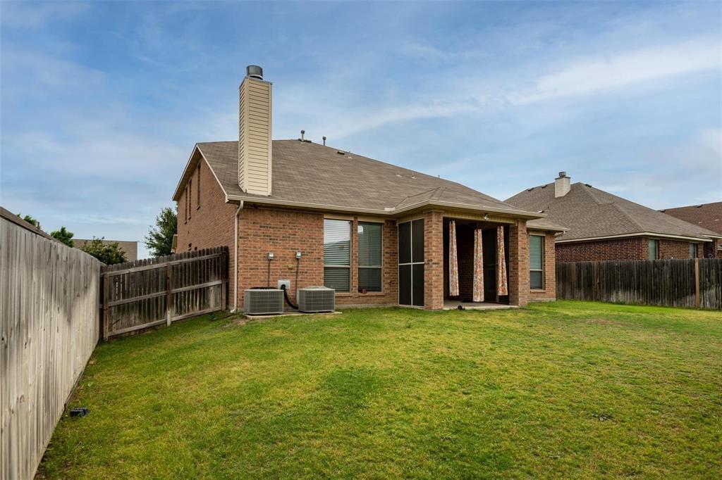 7607 Yearling Way Arlington, TX 76002 - Photo 24 of 25 a view of a house with a yard and sitting area