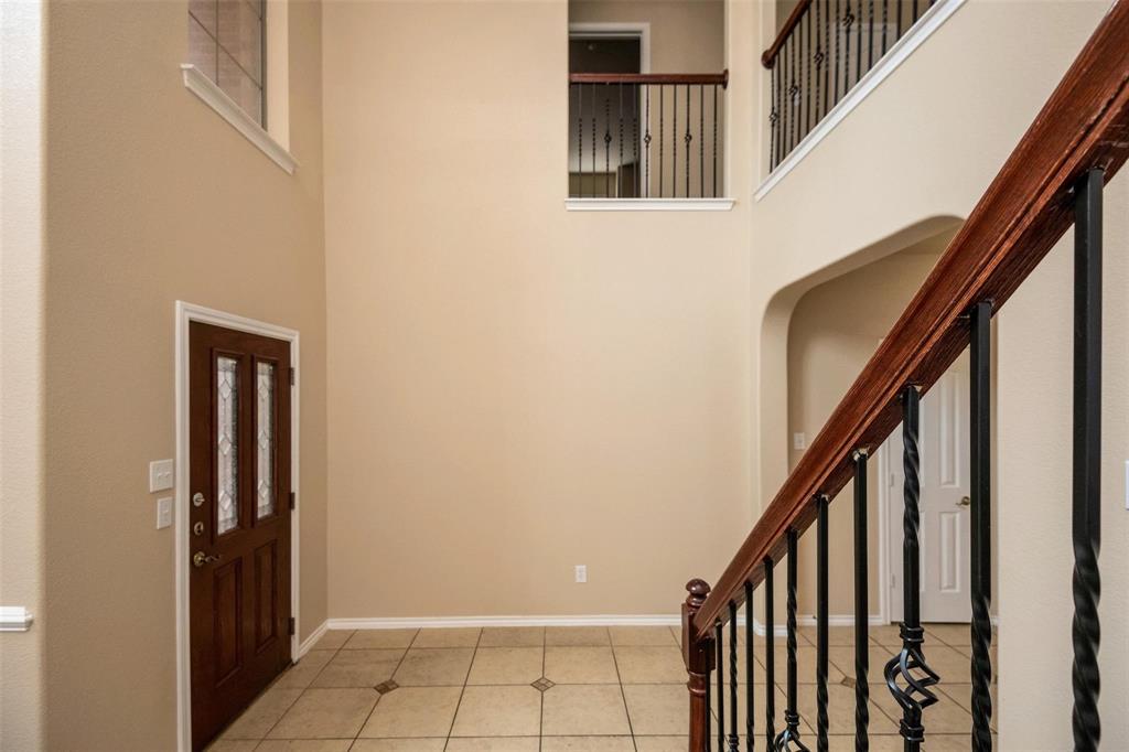 7607 Yearling Way Arlington, TX 76002 - Photo 3 of 25 a view of an entryway with staircase