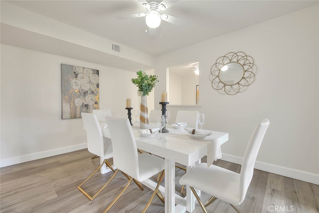 1540 Corte Hacienda Upland, CA 91786 - Photo 15 of 66 a view of a dining room with furniture and wooden floor