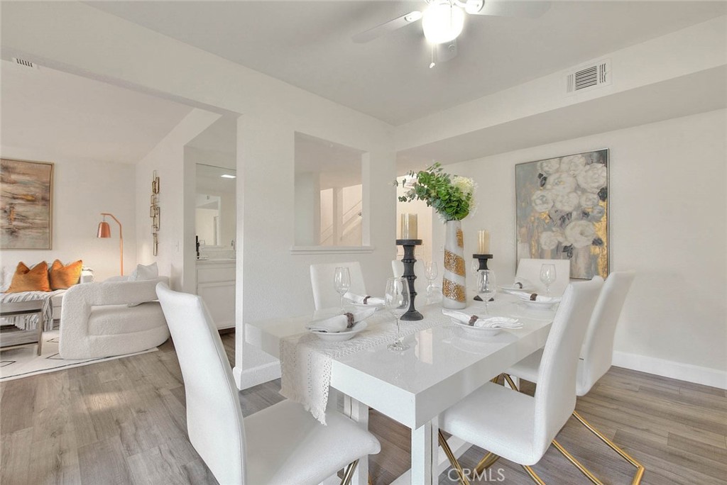 1540 Corte Hacienda Upland, CA 91786 - Photo 16 of 66 a view of a dining room with furniture and wooden floor
