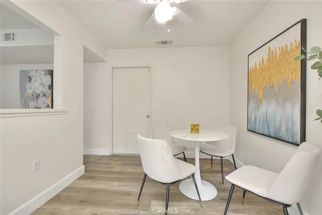 a kitchen with stainless steel appliances a white cabinets and a stove