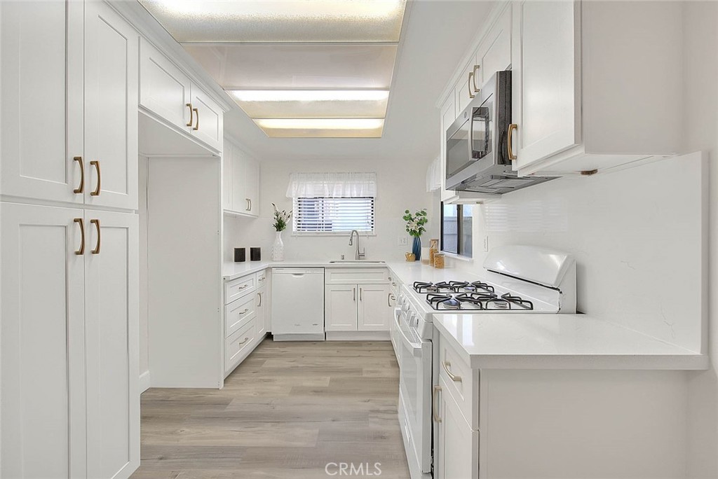 1540 Corte Hacienda Upland, CA 91786 - Photo 21 of 66 a kitchen with stainless steel appliances a white cabinets and a stove