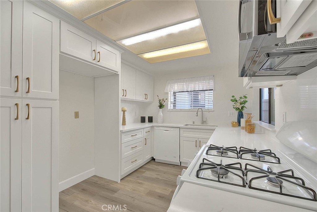 1540 Corte Hacienda Upland, CA 91786 - Photo 23 of 66 a room with white cabinets and white appliances