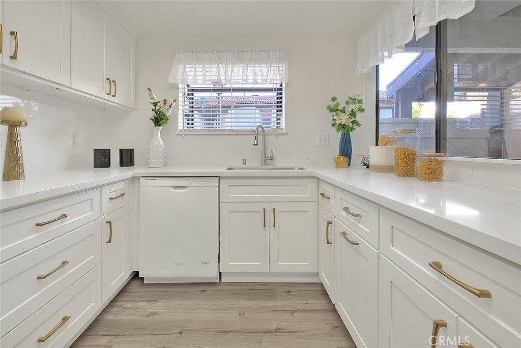 1540 Corte Hacienda Upland, CA 91786 - Photo 25 of 66 a kitchen with granite countertop white cabinets and white appliances