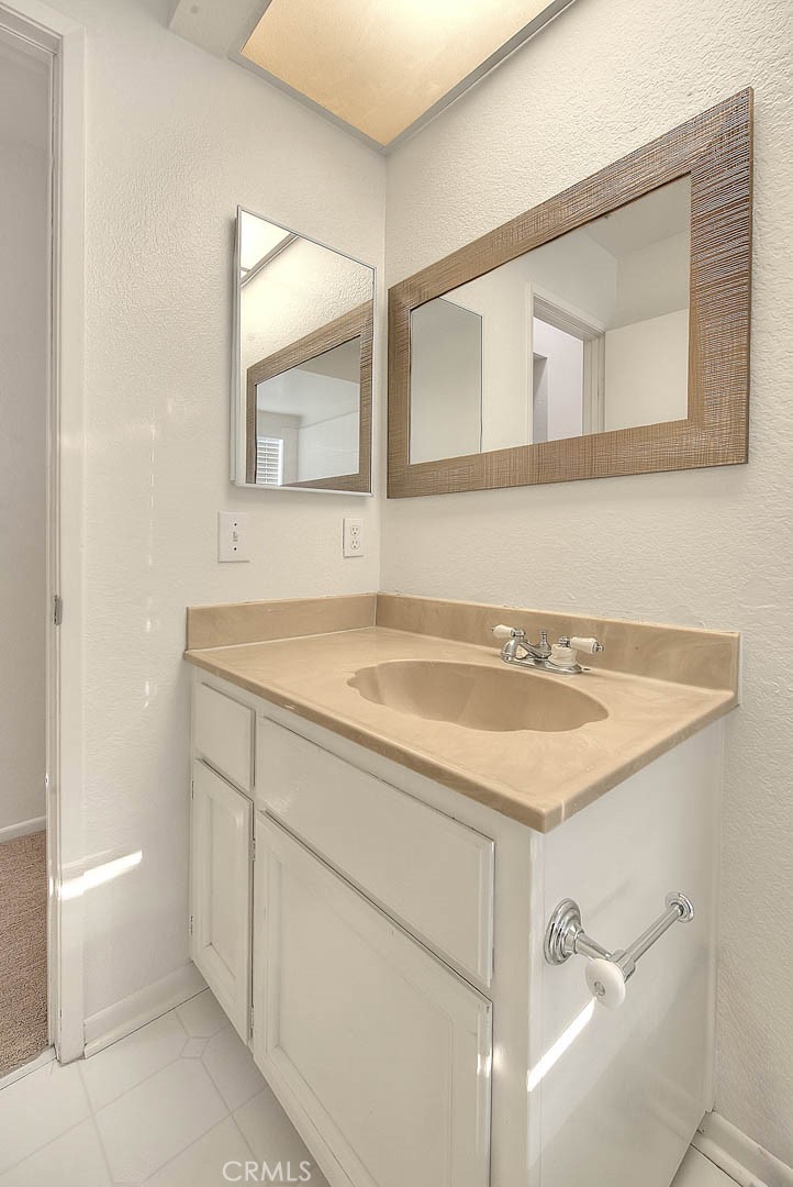 1540 Corte Hacienda Upland, CA 91786 - Photo 30 of 66 a bathroom with a sink and a mirror