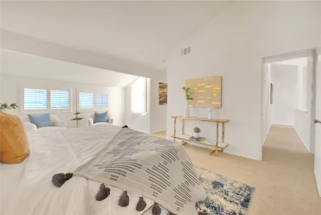 a bathroom with a bathtub next to a window
