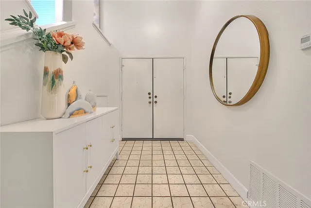 a bathroom with a sink mirror and vanity