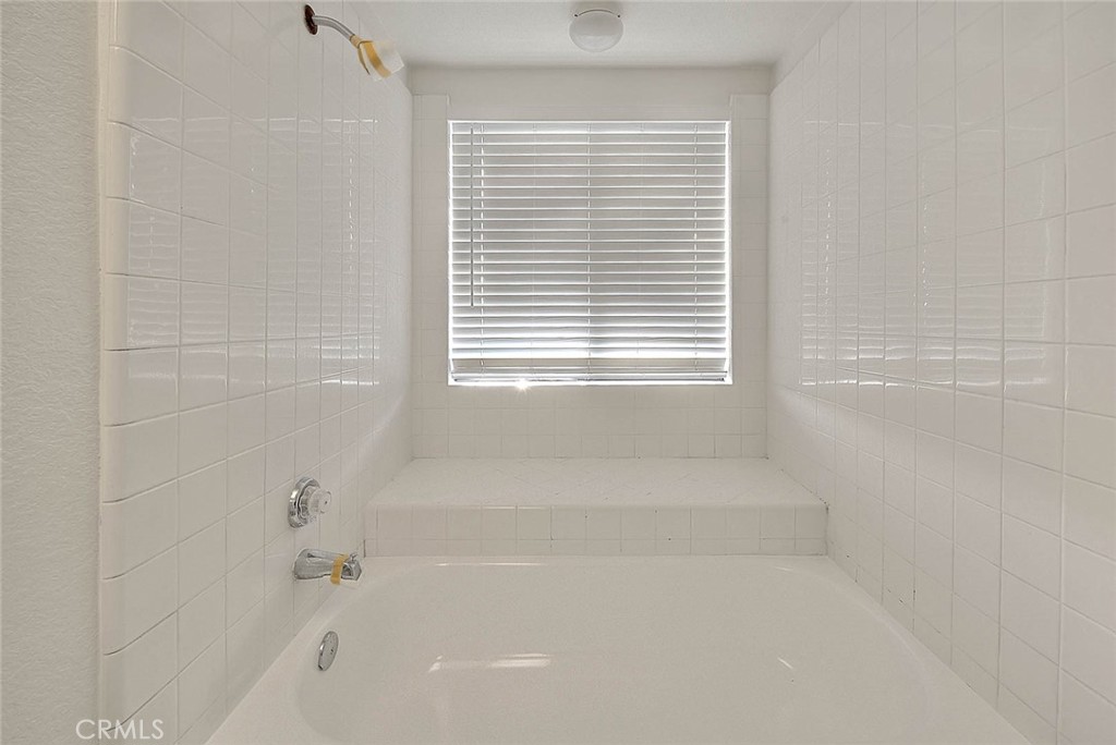 1540 Corte Hacienda Upland, CA 91786 - Photo 53 of 66 a bathroom with a bathtub next to a window