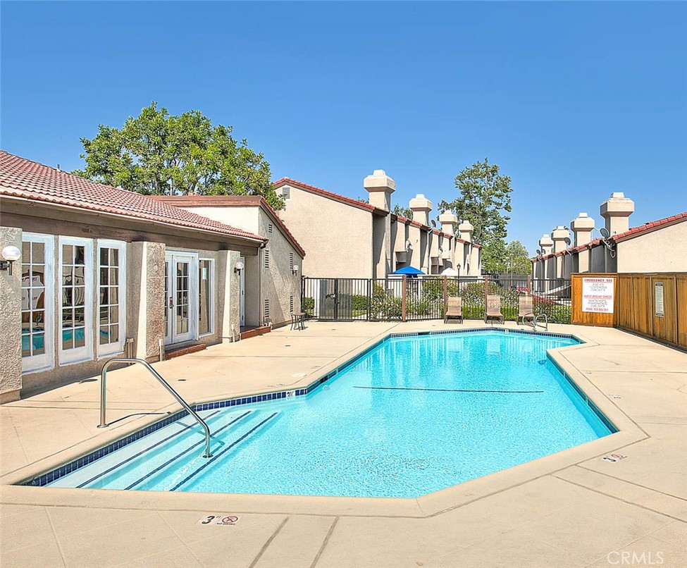 1540 Corte Hacienda Upland, CA 91786 - Photo 59 of 66 a view of a swimming pool with an outdoor space and seating area