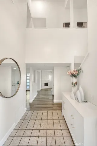 a bathroom with a sink mirror and shower