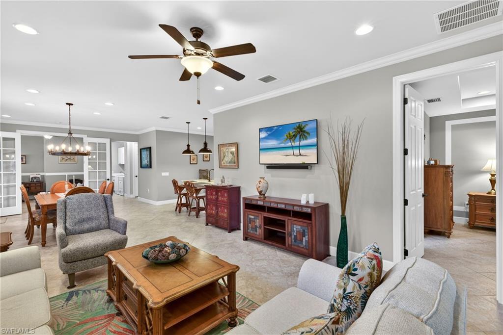 20105 Torch Key Way Estero, FL 33928 - Photo 8 of 29 a living room with furniture kitchen view and a window