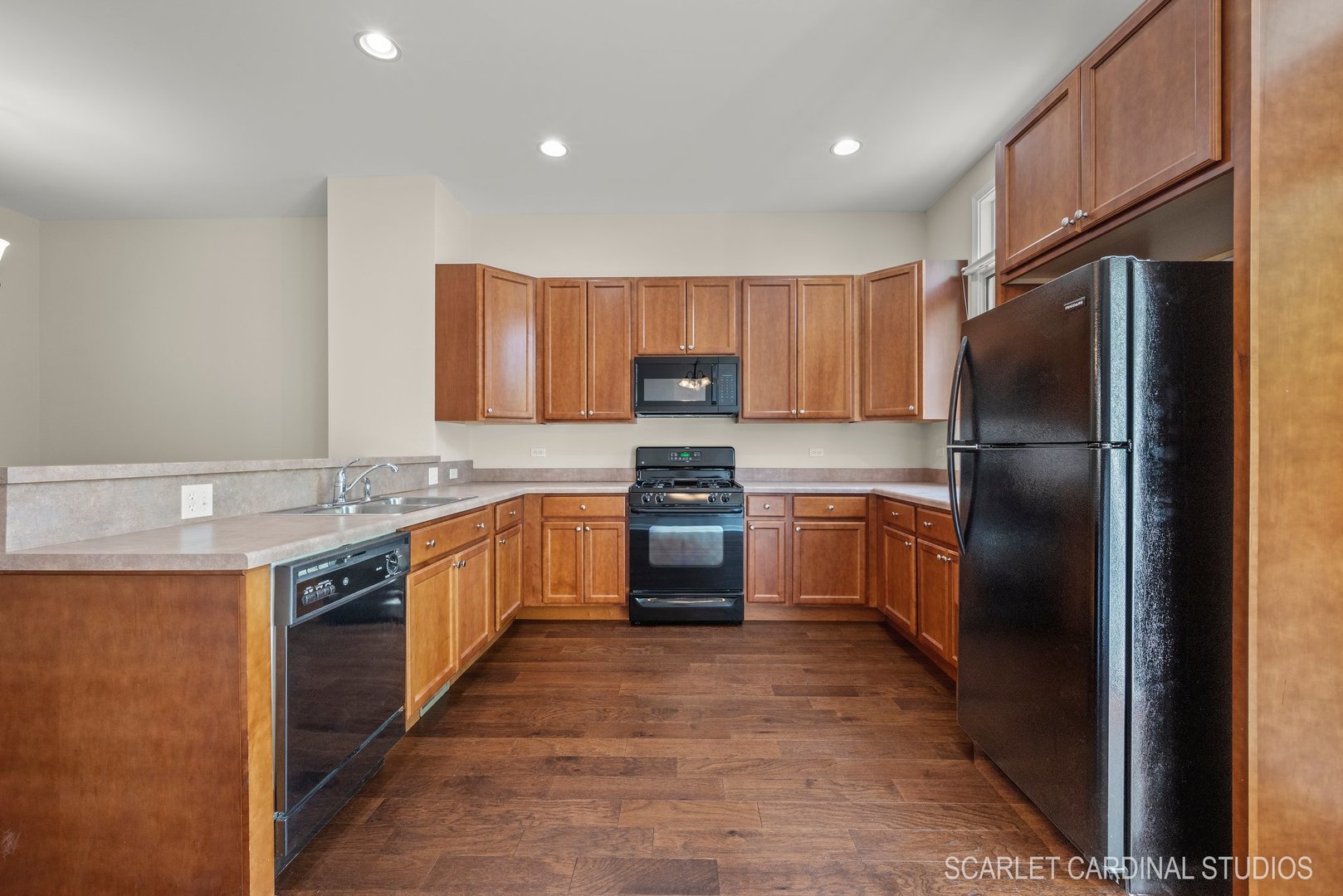 203 Prairie Street Elgin, IL 60120 - Photo 6 of 34 a kitchen with stainless steel appliances granite countertop a refrigerator a stove a sink and a microwave