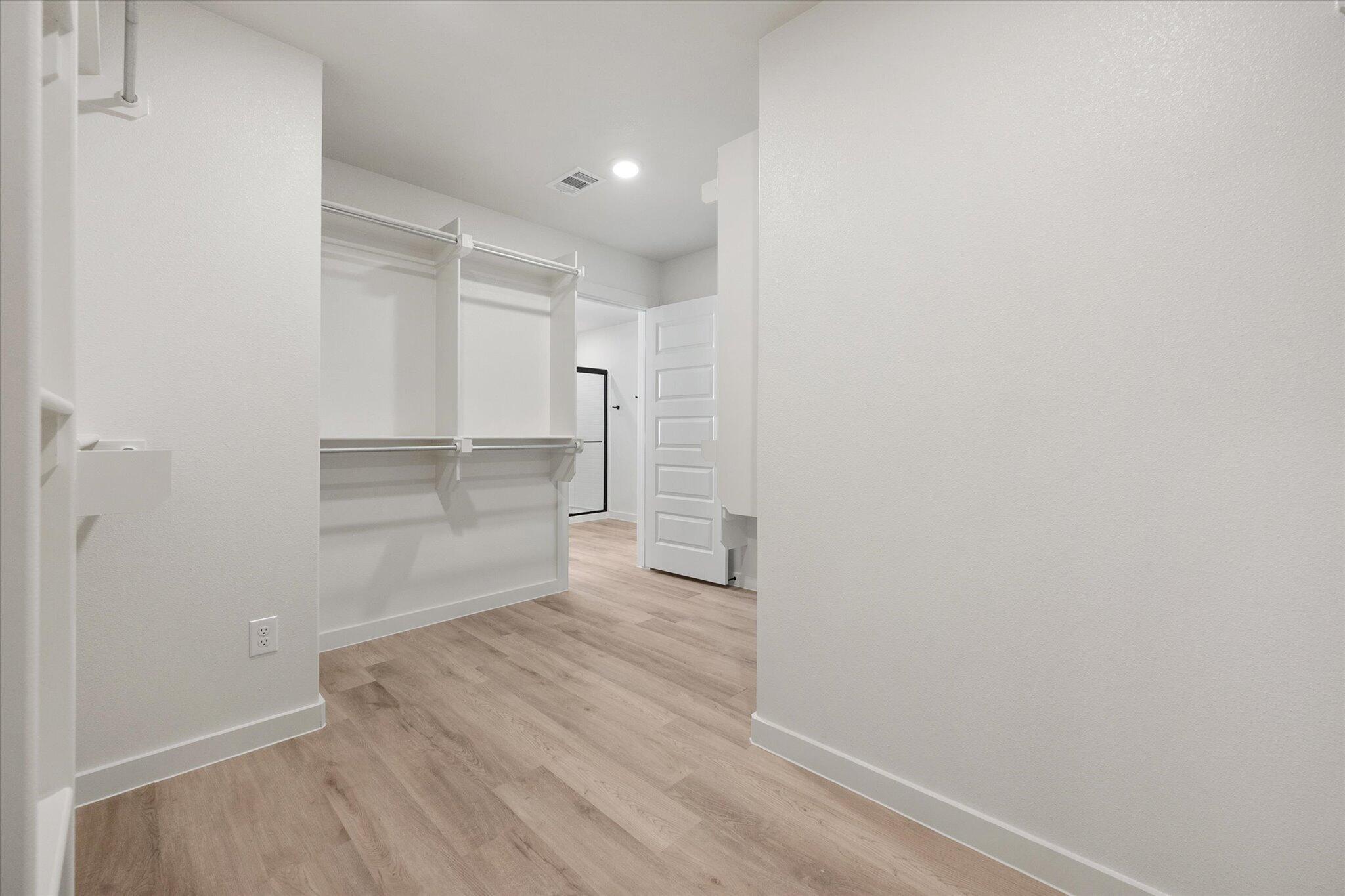 6925 53rd Street Lubbock, TX 79407 - Photo 16 of 22 a view of a room with wooden floor and a window