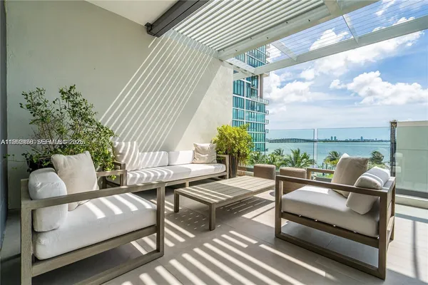 a outdoor living space with furniture and a potted plant