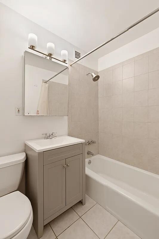 67 East 11th Street, Unit 503 Manhattan, NY 10003 - Photo 6 of 10 a bathroom with a sink a toilet and shower