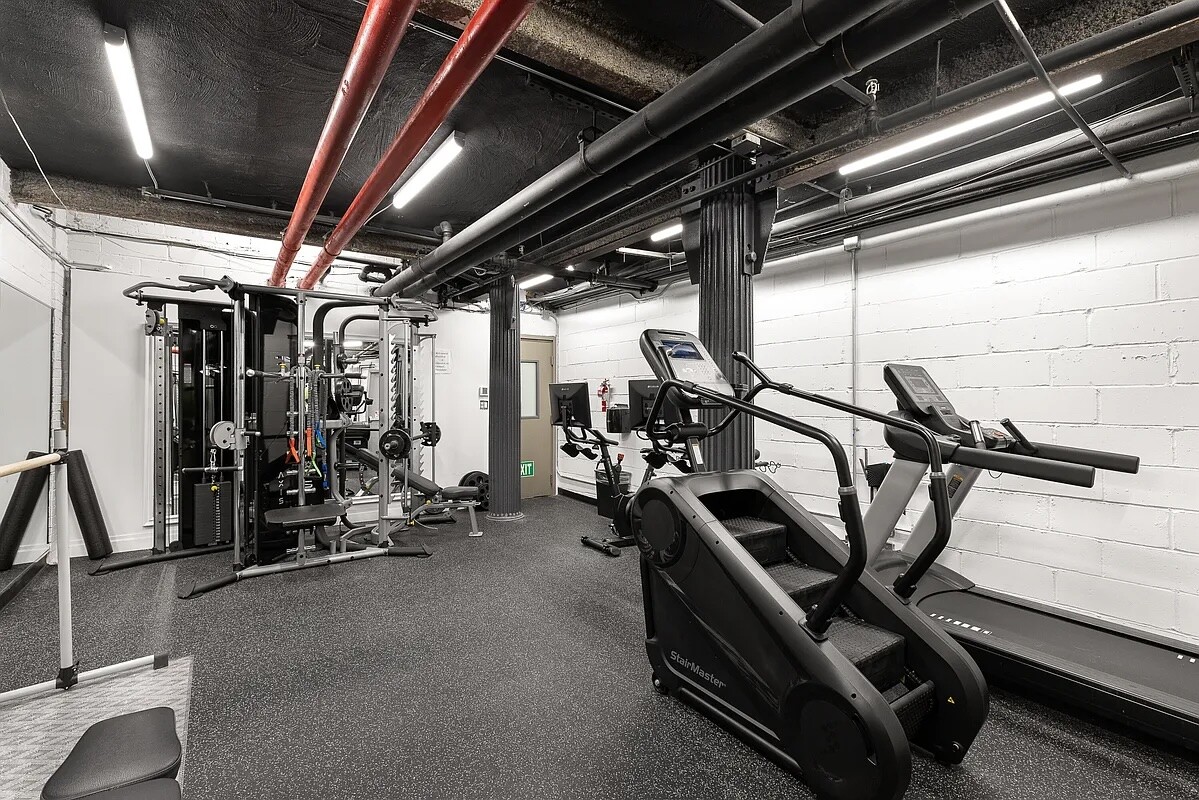 67 East 11th Street, Unit 503 Manhattan, NY 10003 - Photo 7 of 10 a view of a room with gym equipment