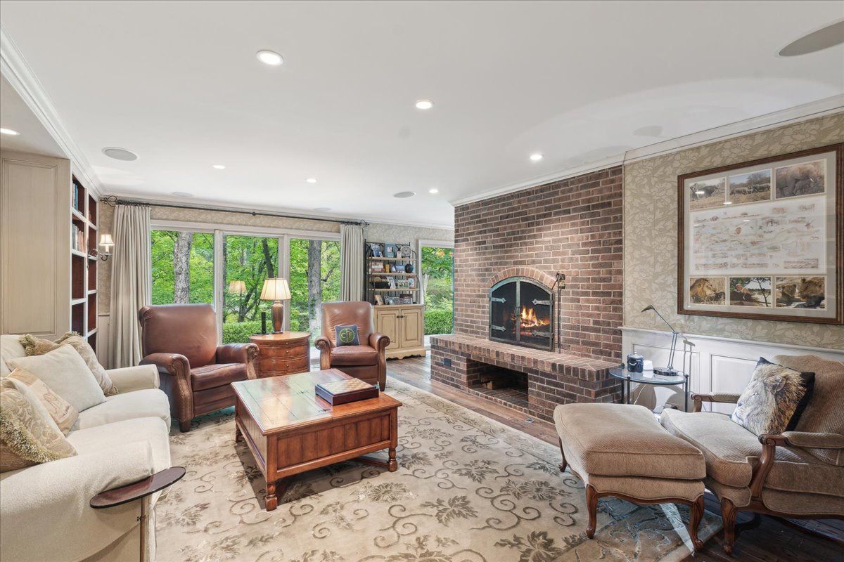 1213 Turicum Road Lake Forest, IL 60045 - Photo 12 of 59 a living room with furniture fireplace and a large window