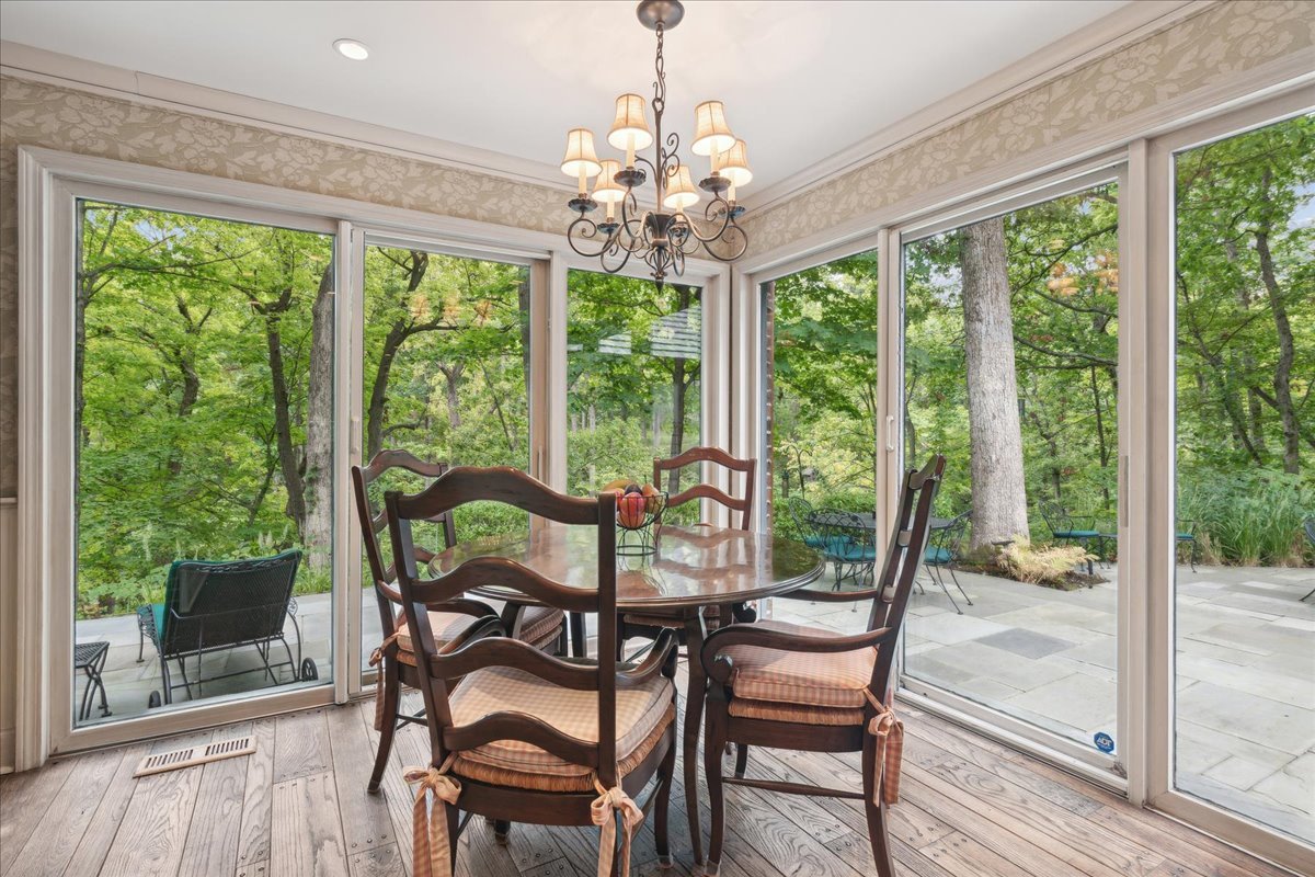 1213 Turicum Road Lake Forest, IL 60045 - Photo 20 of 59 a view of a dining room with furniture window and wooden floor