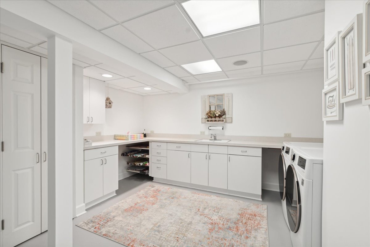 1213 Turicum Road Lake Forest, IL 60045 - Photo 40 of 59 a kitchen with white cabinets and appliances